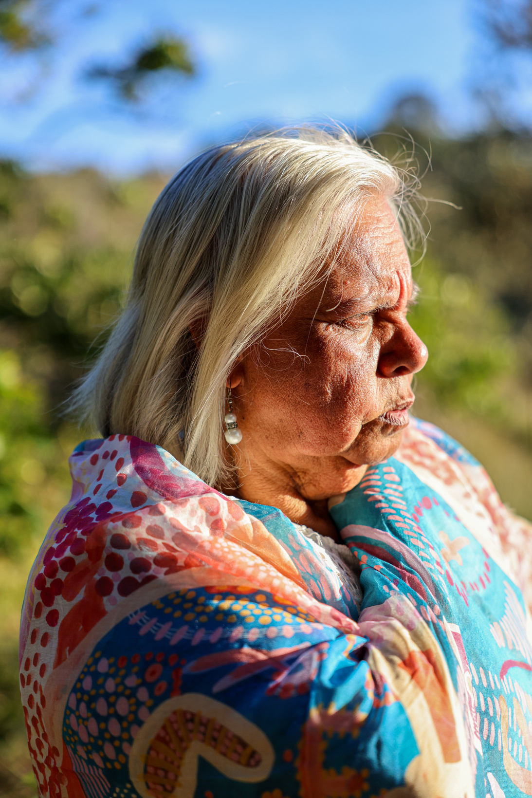 Aging First Nations Woman Wrapped in Blanket Outdoors