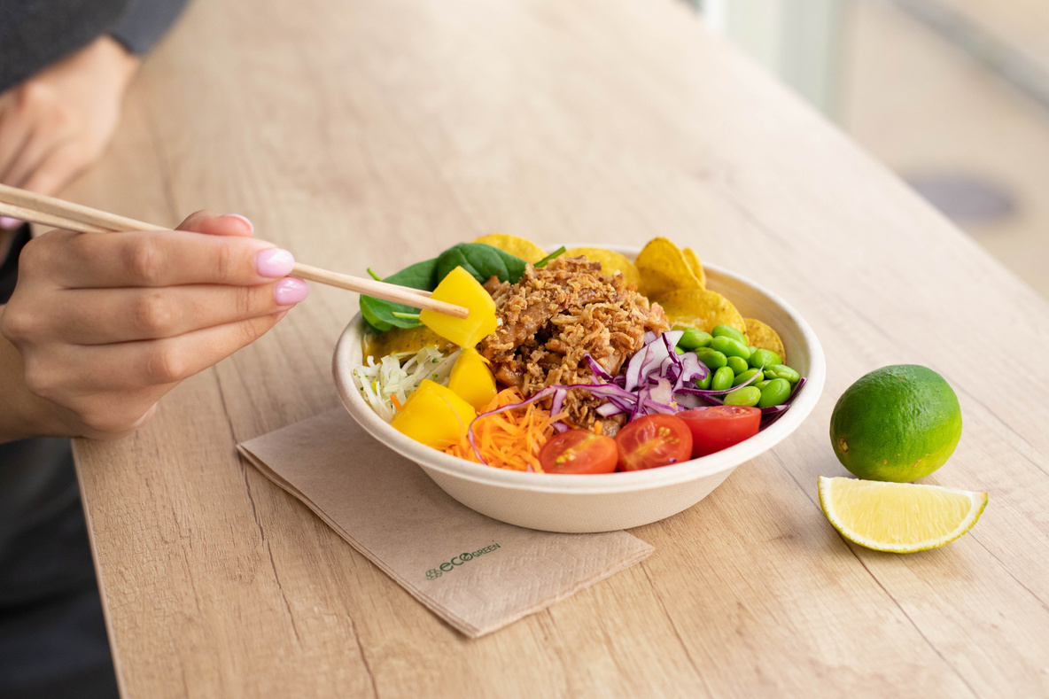 Person Eating Bowl of Salad