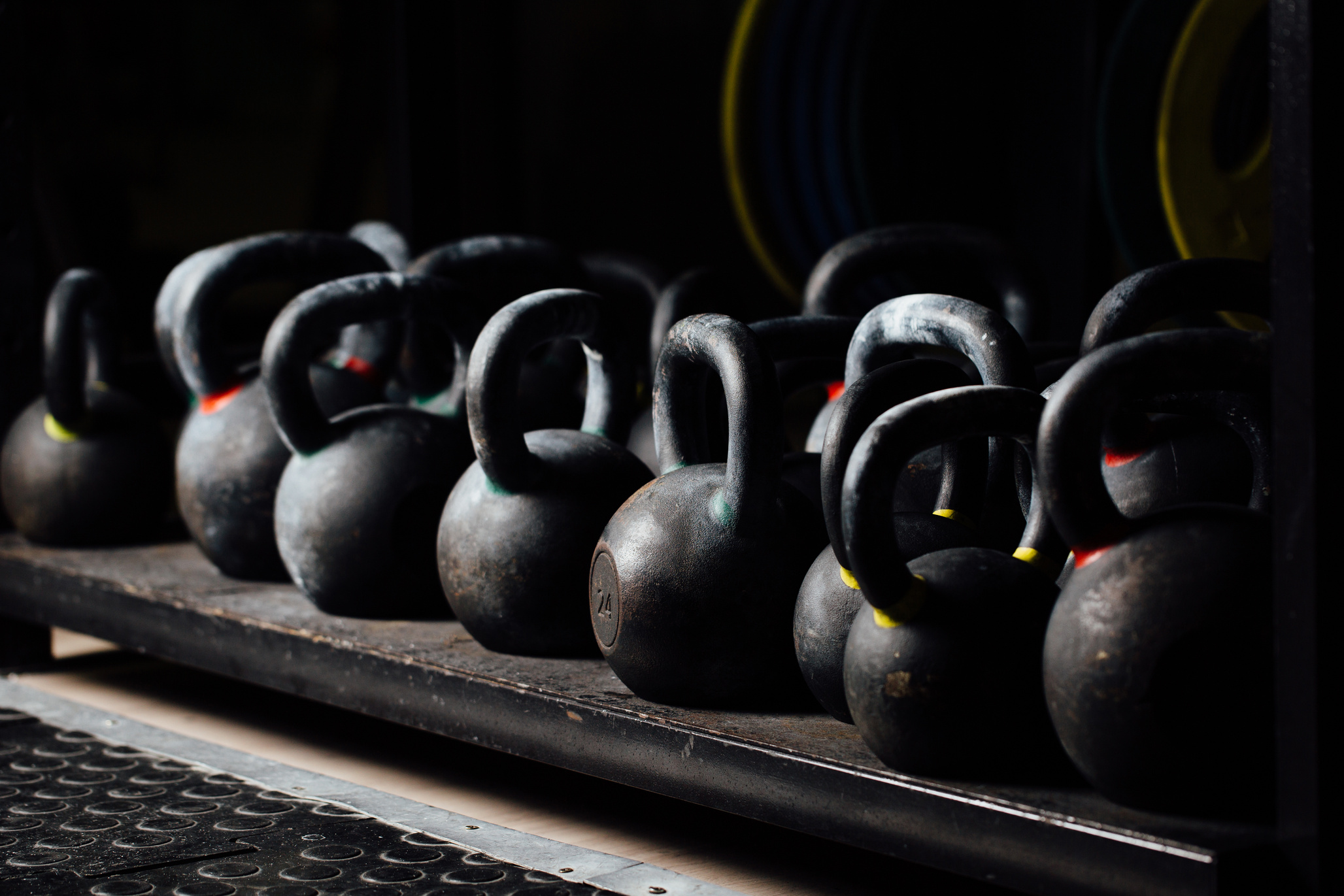 Dumbbell for weight training in gym. Black kettlebells.  24kg. Weightlifting.